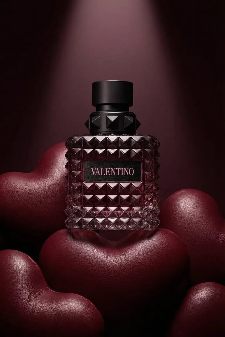 Valentino perfume bottle in a deep burgundy setting