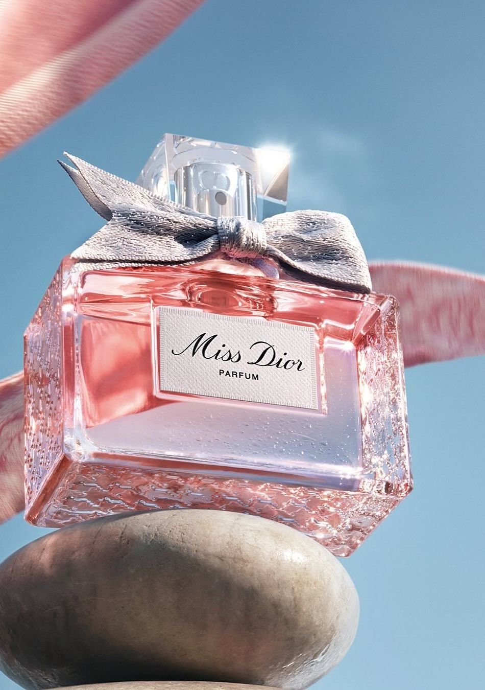 Miss Dior perfume in soft pink and blue light